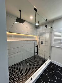 Relaxing Bathroom with Corner Tub and Rustic Flooring: A spacious bathroom showcasing a corner tub, wood-look flooring, and soft lighting for a tranquil and inviting atmosphere.